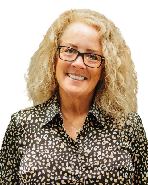 Image of a patient smiling after receiving all-on-x implant dentures.